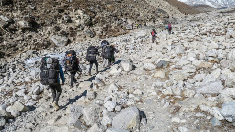people carrying backpack Digital Nomad Guide by a sherpa