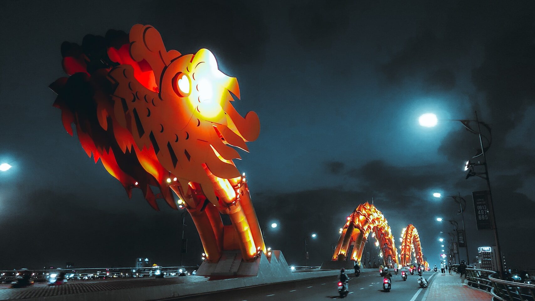 Da Nang 2 red and yellow lights on road during night time in danang